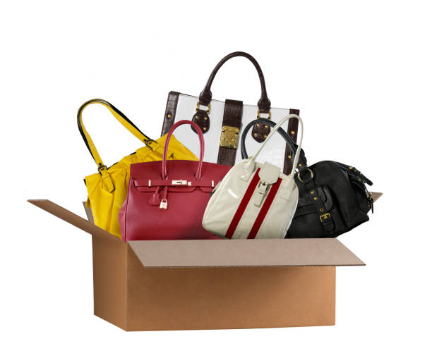 Designer handbags coming out of shipping box