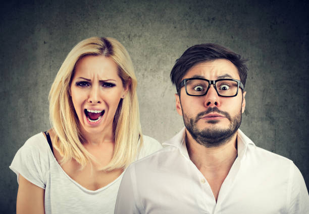 istock Angry woman shouting and fearful man 930597532