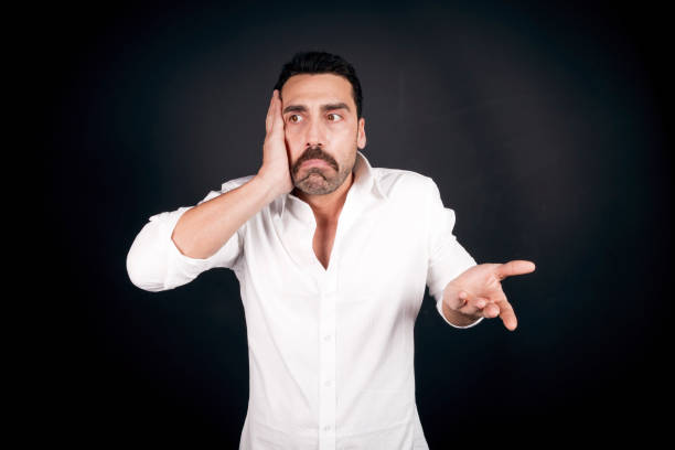 istock Man with moustache showing an anxious facial expression 930597602