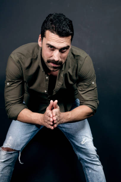 istock Young handsome man with beard and mustache studio portrait 930597660