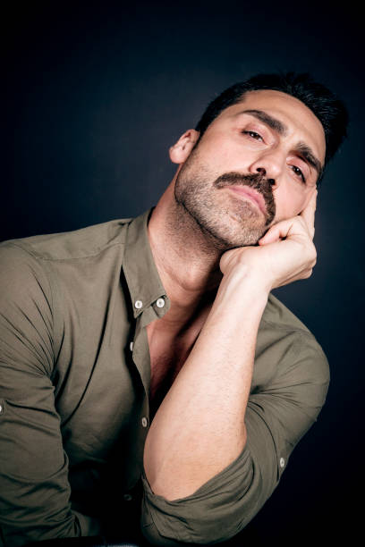 istock Young handsome man with beard and mustache studio portrait 930597704