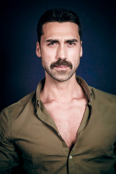 istock Young handsome man with beard and mustache studio portrait 930597744