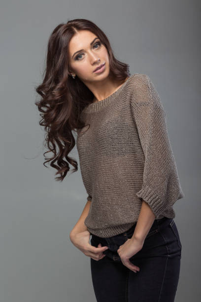 istock woman with shiny silky long curly hair 930598642