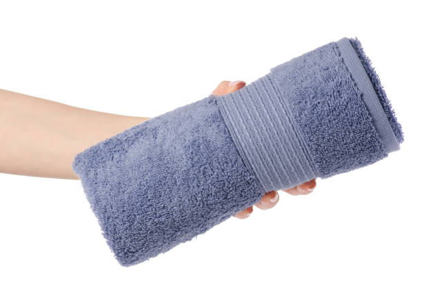 istock The blue gray towel roll in hand 930600694