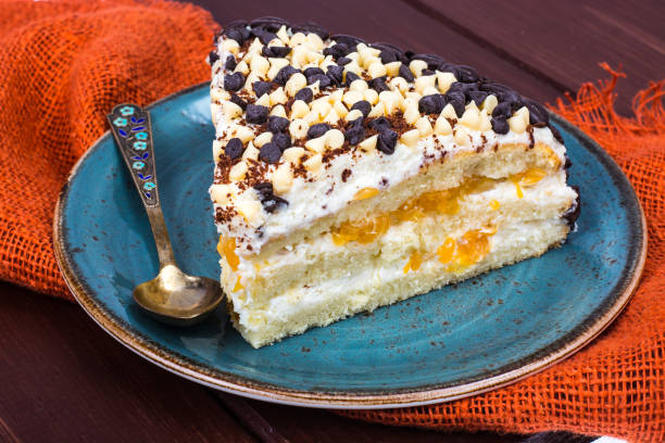 istock Delicious piece of cake with fruit, whipped cream and chocolate drops 930600714