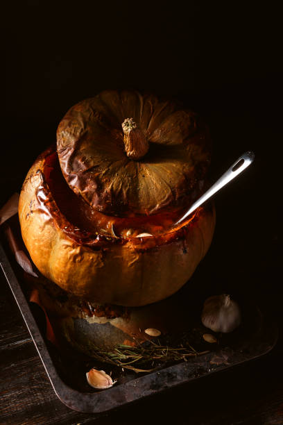 istock pumpkin cream soup poured into a baked pumpkin lying on a rustic baking sheet. 930601688
