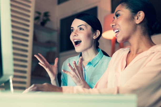 istock Overjoyed women emotionally reacting to online content 930604410