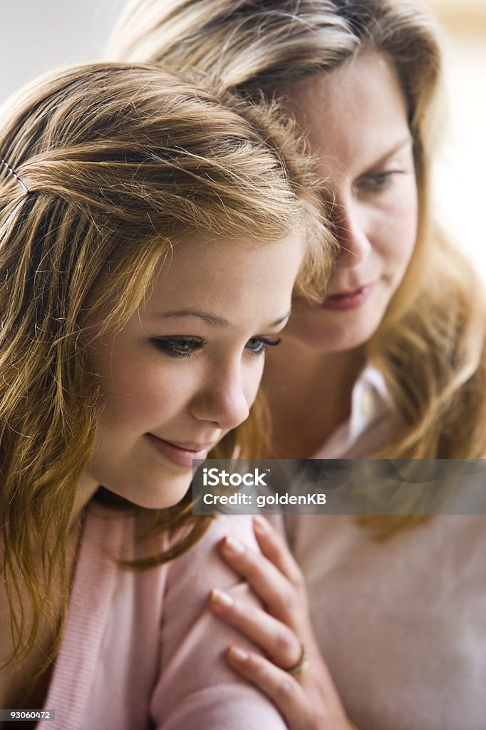 Pretty teenage daughter with her mom  Headshot Stock Photo