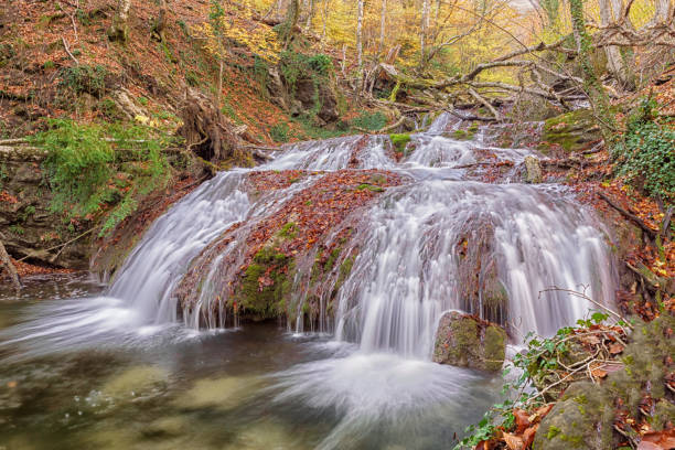 istock landscape with  autumn Waterfall  in the mountains. 930612914