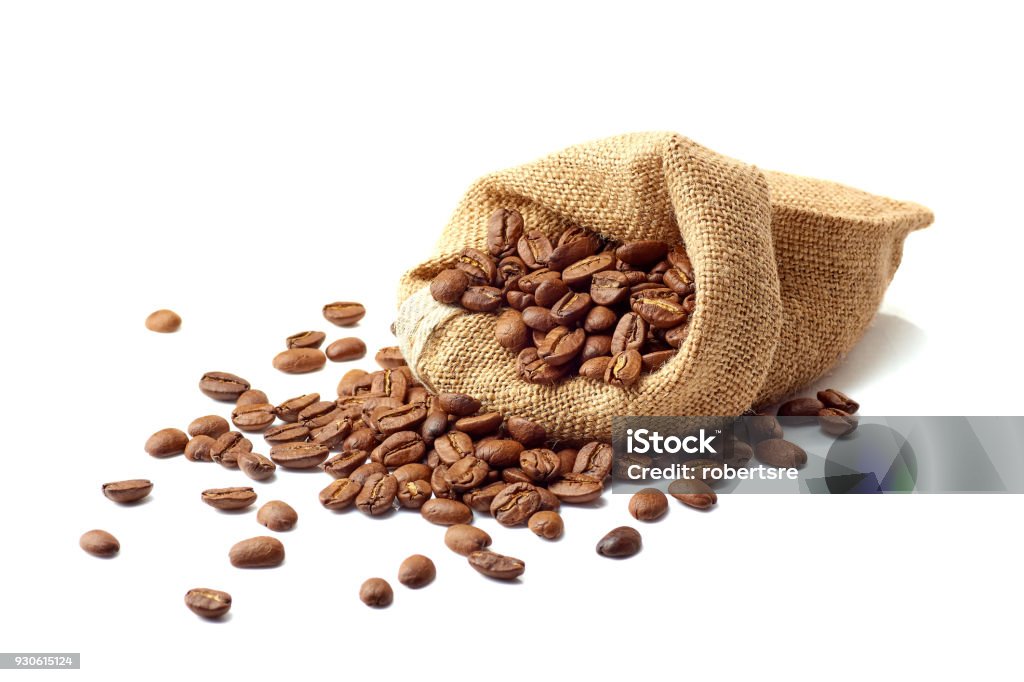 Jute bag with coffee beans on white Jute bag with roasted coffee beans isolated on white background Roasted Coffee Bean Stock Photo