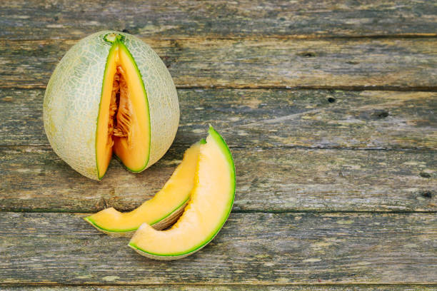 istock Fresh melons sliced on wooden table 930615126