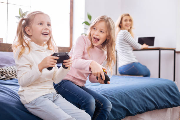 istock Inspired young girls playing a game 930622570