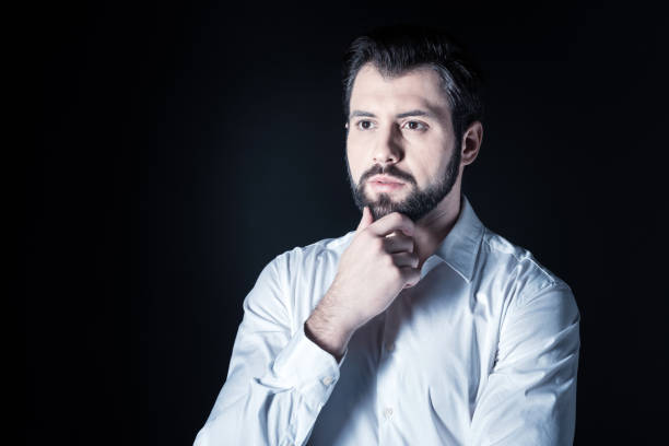 istock Serious smart man focusing on his thoughts 930626448
