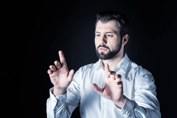 istock Pleasant handsome man looking at his fingers 930628476
