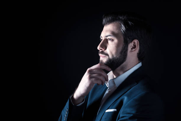 istock Smart thoughtful businessman holding his chin 930630726