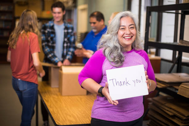 istock Volunteer Holding a Sign 930637278
