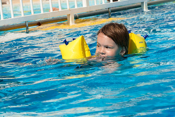 istock Girl swimming in blue water. 93064288