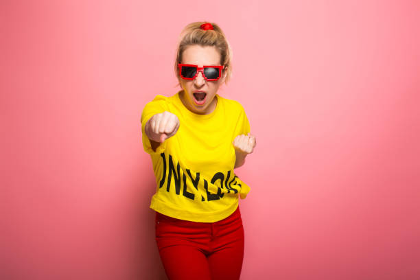 istock Blonde woman in bright clothes 930658074