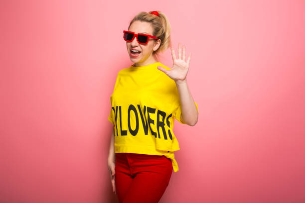 istock Blonde woman in bright clothes 930658076