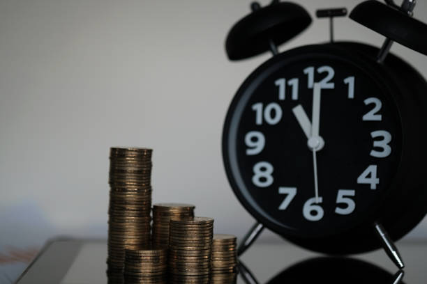 istock Step of coins stacks and alarm clock with tablet computer and financial graph, business planning vision and finance analysis concept. 930658864