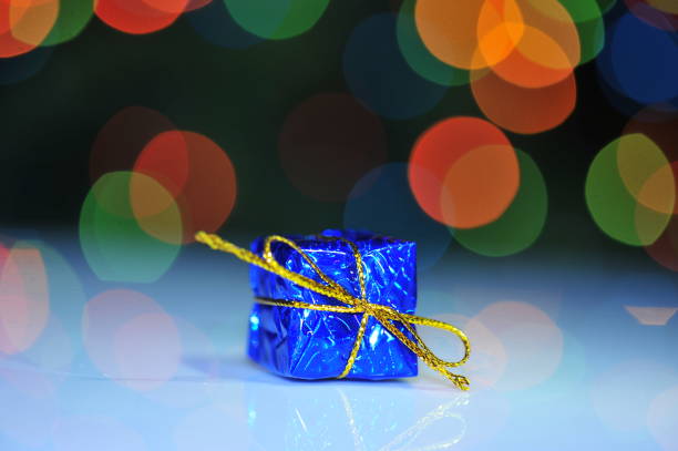 istock Christmas gifts and abstract background light 930662660