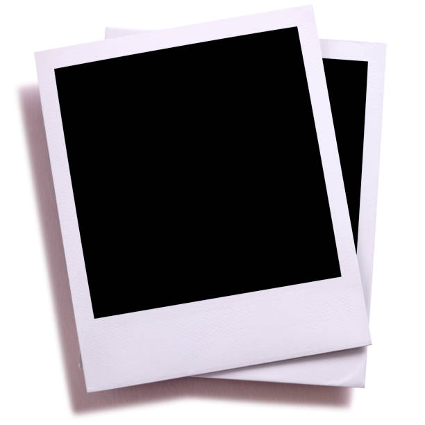 istock Two blank instant camera photo prints isolated on white with shadow. 930675222