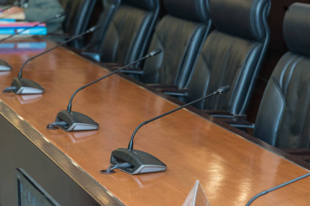 istock Table, chair, microphone in the meeting room. 930693490