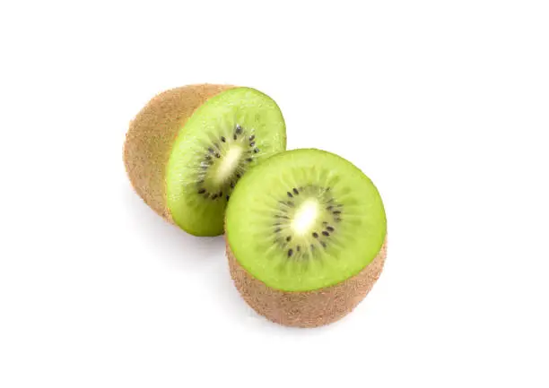 Photo of Single whole Kiwi cut in half isolated on white background