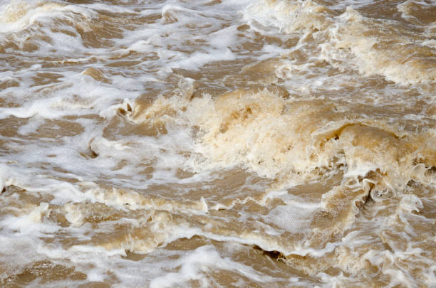 istock Turbid flood waters flow over rapids after heavy rains 930704678