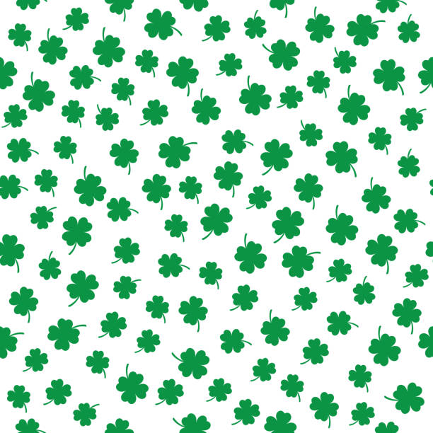 Little Four Leaf Clovers Seamless Pattern Vector seamless pattern of little green four leaf clovers on a white background. st patricks day clover stock illustrations