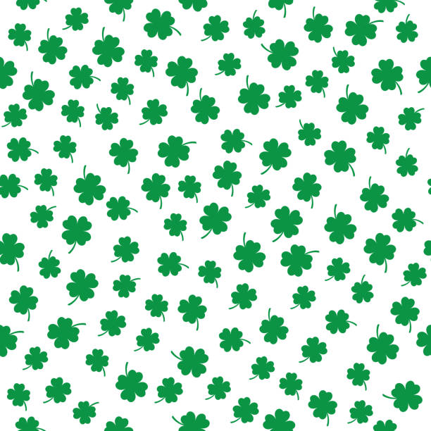 Little Four Leaf Clovers Seamless Pattern Vector seamless pattern of little green four leaf clovers on a white background. pics for shamrocks to print stock illustrations