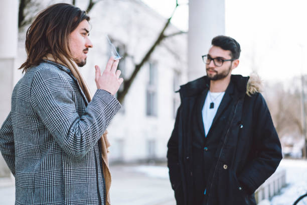 Coworkers on a cigarette break outdoors