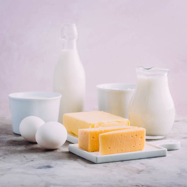 istock Fresh dairy product on kitchen table. Cheese, eggs, milk, cottage cheese, yogurt, cream and butter 930711996