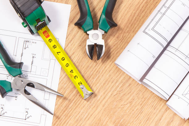 istock Rolls of electrical diagrams and work tools for engineer jobs, technology concept 930713040