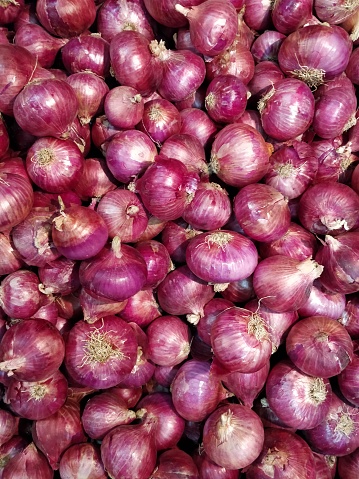 Full frame close-up shot of onions for sale