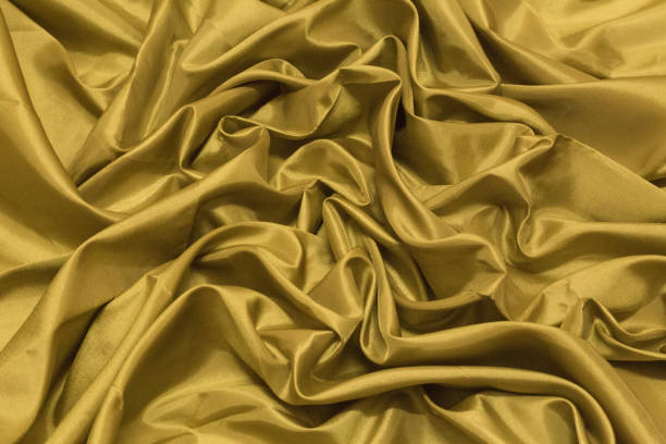 istock Smooth elegant gold silk or satin luxury cloth texture can use as wedding background. Luxurious Christmas background or New Year background design.Golden Canvas for Background. 930718670