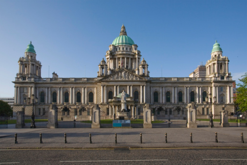 Stock photo showing exterior of the Portland stone Baroque Revival style architecture of Belfast City Hall, Donegall Square, Belfast, Northern Ireland.