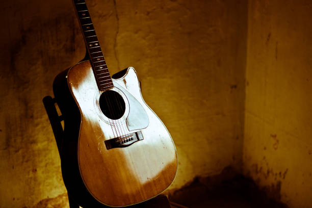 istock A classic guitar in an ancient house 930728734