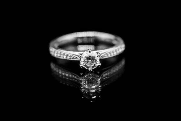 istock Close up Jewelry diamond ring on black background with reflection 930729318