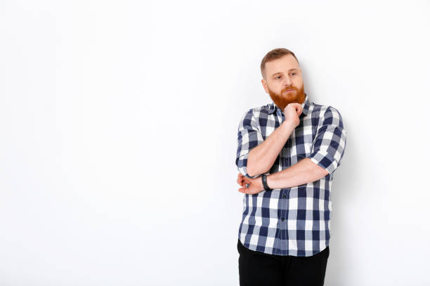 istock man with red hair and beard in plaid shirt 930730116