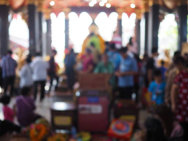 istock Abstract blurred unidentified buddhist people making merit at the temple 930730446