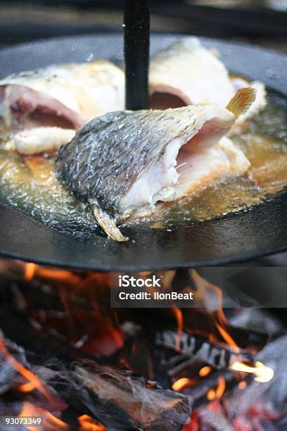 Fish Cooking On Open Fire Stock Photo - Download Image Now - Campfire, Carp, Color Image