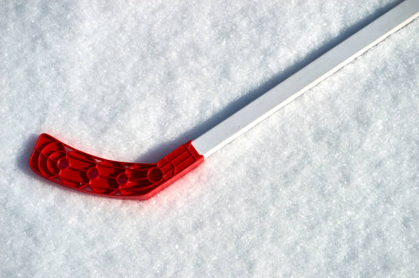 istock hockey stick on the snow 930737372