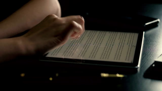 woman hand using smart phone to reading on ebook