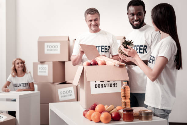 istock Group of volunteers packing humanitarian help 930743542