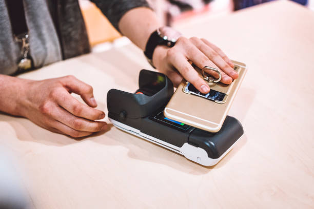 istock Paying for cashiers services using a smart phone 930744420