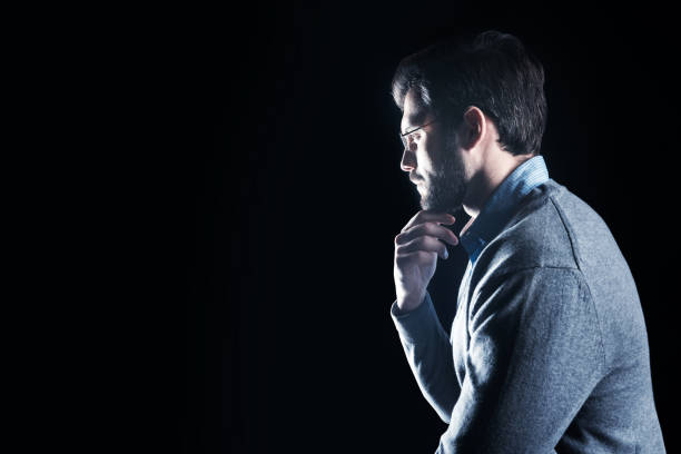 istock Serious intelligent man holding his chin 930744804
