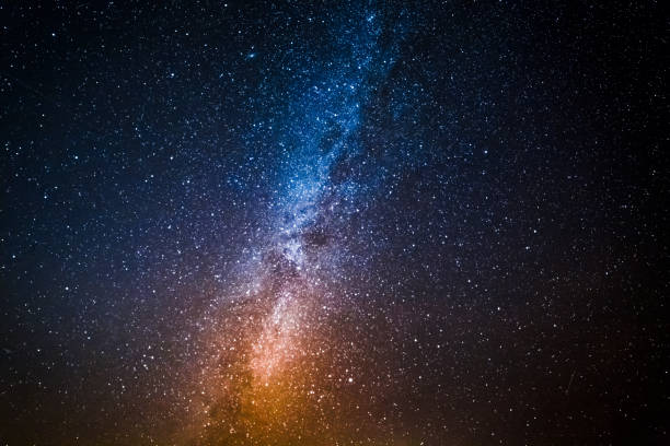 istock Milky way with million stars at night 930745182