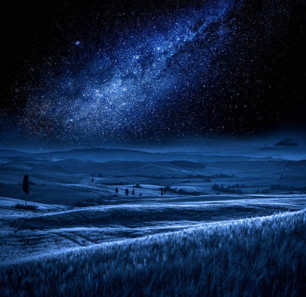 istock Tuscany at night with milky way, Italy 930750502