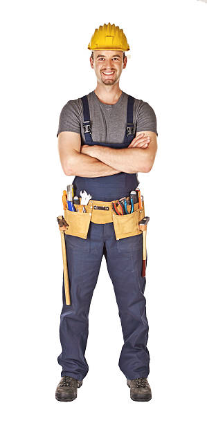 istock smiling young handyman crossed arms isolated on white 93076463